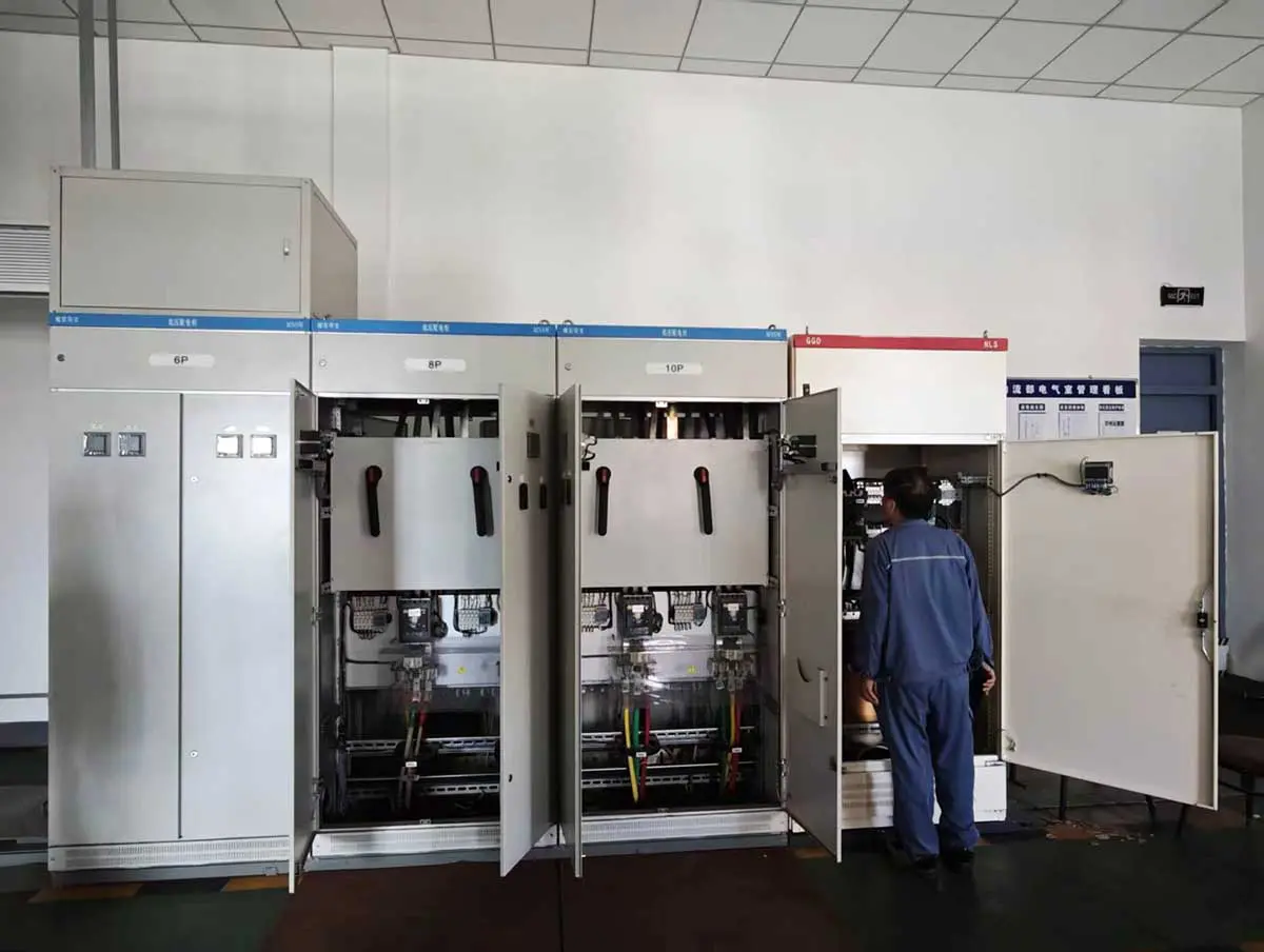 Winzele and Baosteel personnel inspecting a transformer cabinet before energization