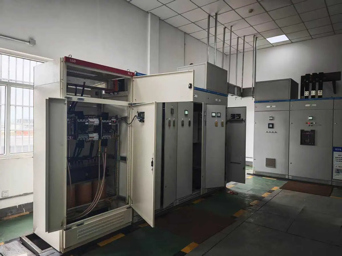 Interior view of an installed 200 kVA isolation transformer cabinet and its connected conductors