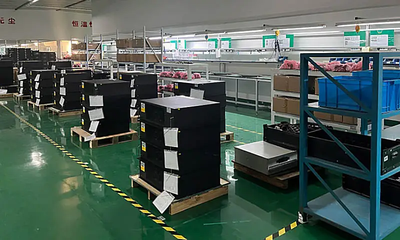 Batch production area with multiple SVG modules organized for assembly and inspection