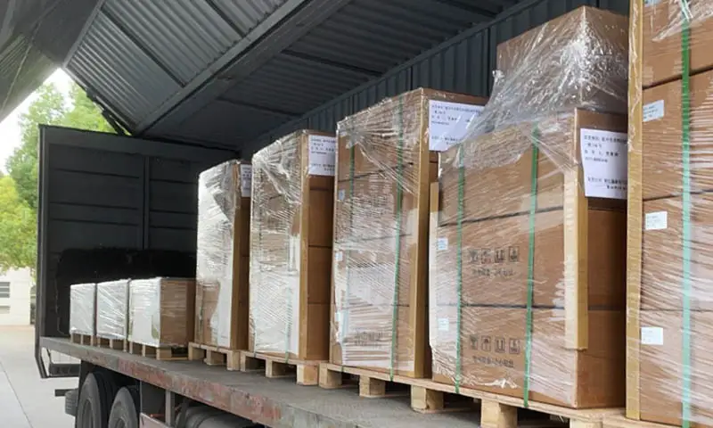 Packaged SVG equipment secured on pallets and loaded for shipment