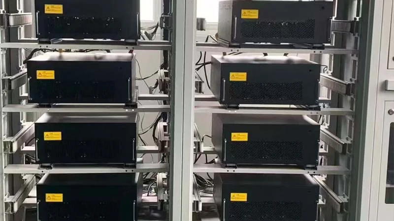 Multiple AHF power modules mounted inside a cabinet during assembly inspection