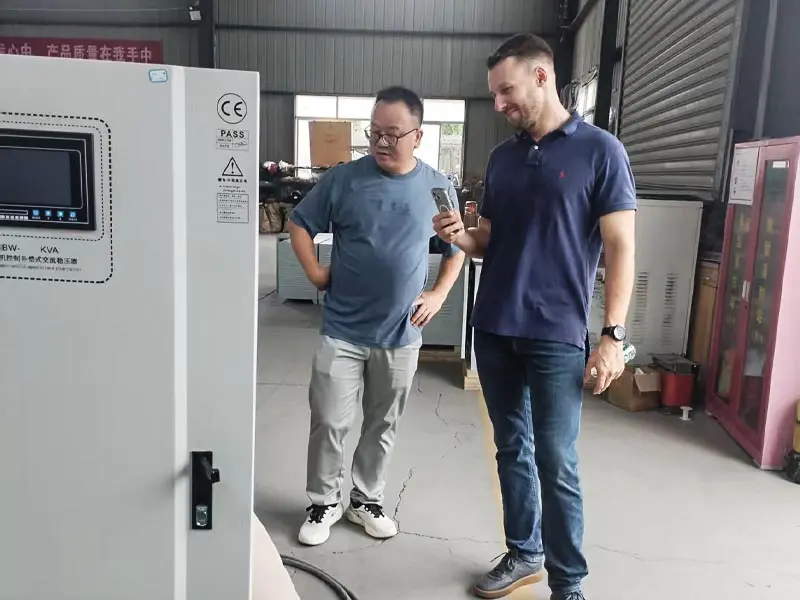 International customer reviewing industrial equipment at Winzele factory