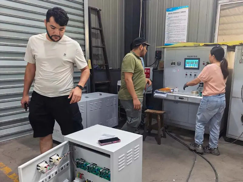 Overseas customer inspecting equipment during factory visit
