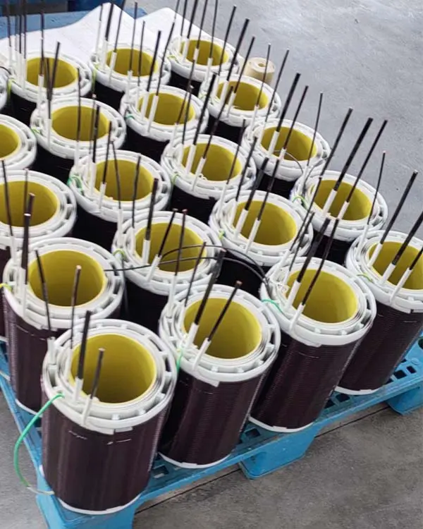 Completed windings of a three-phase dry-type isolation transformer ready for core assembly